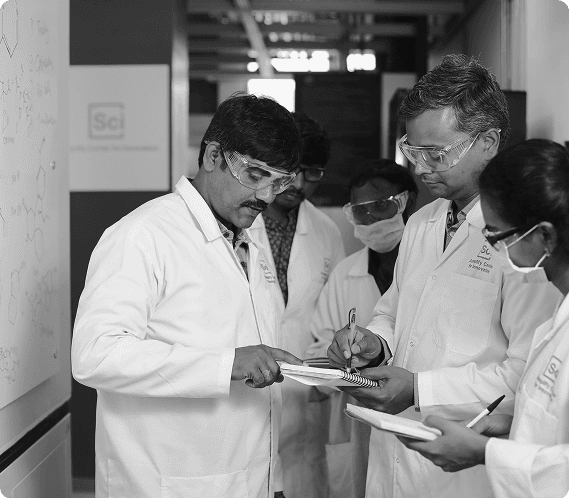 Scientists collaborating in a chemical research laboratory