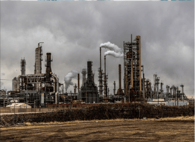 Industrial manufacturing plant with smoke stacks