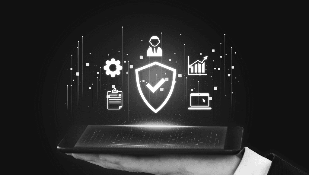 Hand holding a tablet displaying digital compliance and security documentation